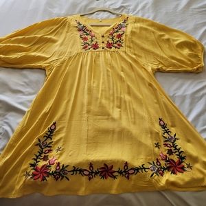 Fiesta style yellow dress with embroidery.
